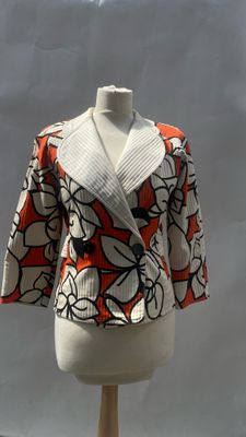 a white mannequin with a red and white jacket on it