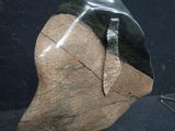 a rock with a leaf on it and a pair of scissors