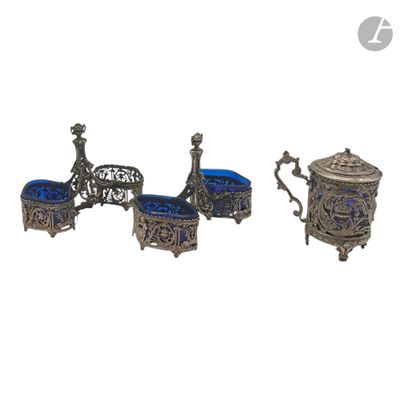 three pieces of silver and blue glass on a white background
