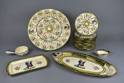 many plates and bowls that are sitting on a table