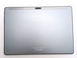 a silver laptop computer sitting on a white surface