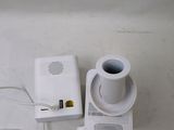 a cup of coffee sitting on top of a table next to a charger