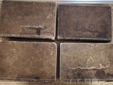 four pieces of chocolate sitting on top of a wooden table