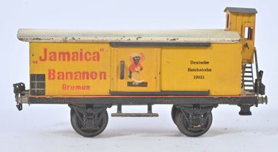 toy train car with a yellow caboose on the side of it