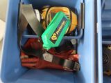 a blue container with tools in it on the floor