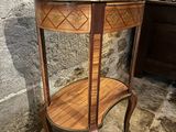a small table with a shelf on top of it