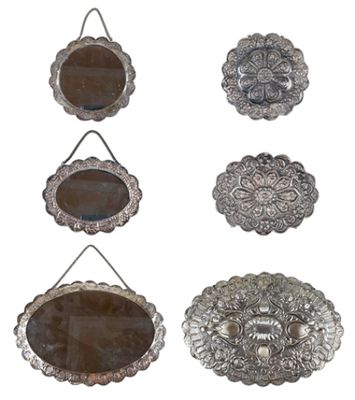six silver plated mirrors hanging on a rope