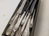 a box of silverware that is sitting on a table