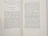 someone is holding a book open to a page with a picture of a clock on it
