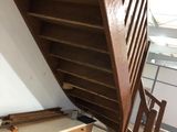 a wooden staircase going up to the top of the stairs