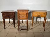 three wooden tables with drawers on them in a room