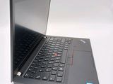 a laptop with a black keyboard on a white surface