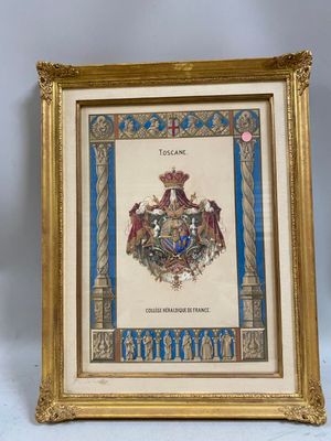 an old framed picture of a coat of arms with a gold frame