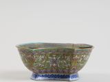 a close up of a bowl on a table with a white background