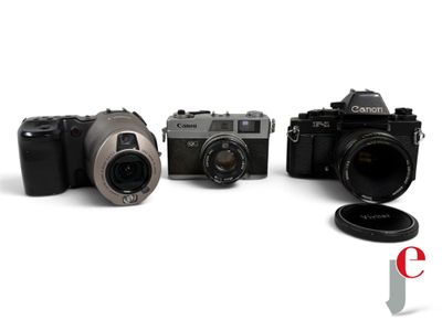 three cameras sitting next to each other on a white surface