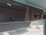 a view of the inside of a vehicle from the driver ' s seat