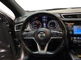 the interior of a car with a steering wheel and dashboard controls