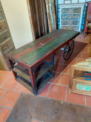 a wooden table and a wooden bench in a room