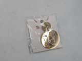a picture of a gold coin on a piece of plastic