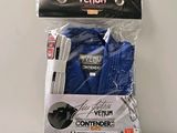 a package of items that include a blue shirt and a white pen