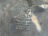 a close up of a metal object with a logo on it