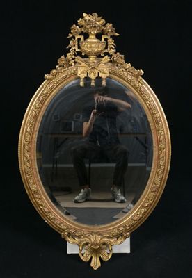 a man taking a picture of himself in a mirror