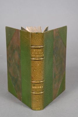 a book that is open to show a green cover