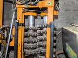 an image of a machine that is working on a piece of machinery