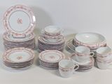 a lot of plates and cups on the table