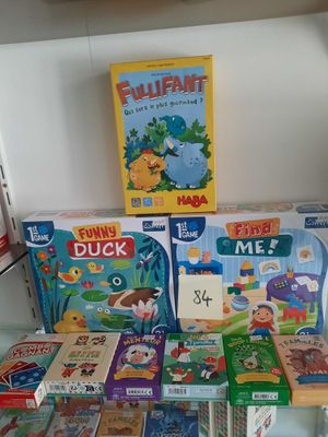 many children ' s board games on display in a store