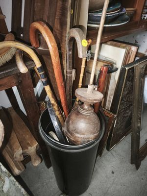 many different types of umbrellas that are in a bucket