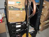 a stack of boxes and a pair of scissors on a cart