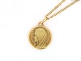 a close up of a gold locke with a woman ' s face on it