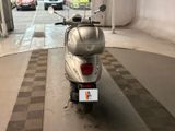 a scooter that is parked in a garage