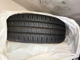 two tires in a white bag on a white surface
