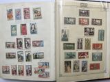 an open book with stamps on it on a table