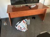 a flat screen tv sitting on top of a wooden table