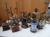 many different types of antique lamps on a table