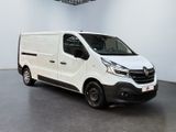 the white van is parked in a large room with a ceiling fan