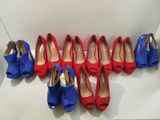 six pairs of red and blue shoes lined up in a row