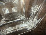 a close up of a glass with a flower on it
