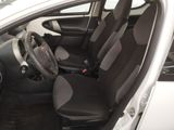 the interior of a white car with black seats and a steering wheel