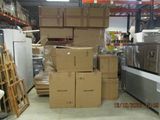 many boxes stacked on top of each other in a warehouse