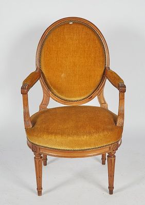 an image of a chair with a yellow upholstered seat