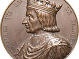 an image of a close up of a medal with a crown on it
