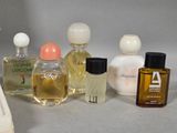 several different types of perfume bottles on a table