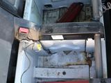a small refrigerator with a red box inside of it
