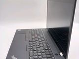 a laptop with a black keyboard sitting on a white surface