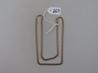 a gold chain with a price tag attached to it