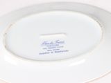 a white plate with a blue and white design on it